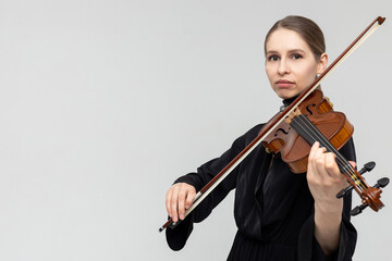 Woman professional violist playing musical instrument © zinkevych