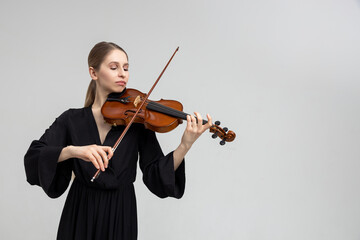 Woman musical artist playing violin