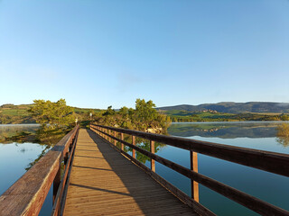 bridge leading to the island of the lake: Alloz, province of Navarra Spain