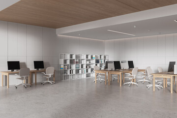 Stylish business interior with coworking space and shelf with documents