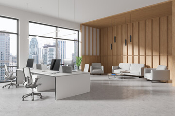 Fototapeta premium Cozy office interior with coworking and lounge zone near panoramic window