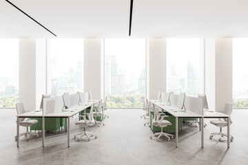 Modern office coworking interior with table and pc monitors, panoramic window