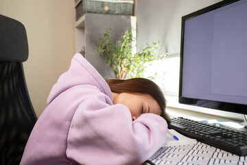 Teenager fell asleep while studying at home, exhausted from hours of homework. Student overwhelmed...
