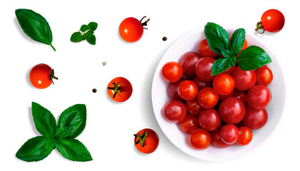 A cup of cherry tomatoes and separately lying tomatoes with basil and oregano leaves, black pepper...