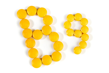 Vitamin B Pills isolated - B9 on white background