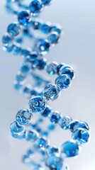 a close up of a spiral of blue beads on a white surface