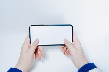 contactless in new normal concept from woman hand hold and smart phone with white isolated background