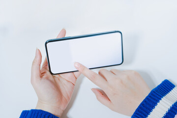 contactless in new normal concept from woman hand hold and smart phone with white isolated background