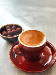 A cup of coffee and truffle