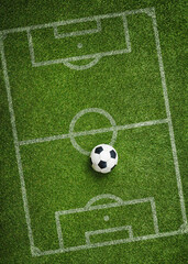 Green grass texture with a soccer ball as a tactical poster. Soccer strategy with copy space.