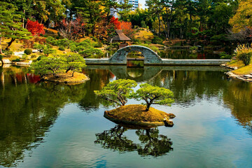 Bridge over the lake in Shukkeien Gardens in Hiroshima, Japan