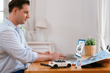 Focus scale EV car and charging station mockup model on blurred background of automotive design...