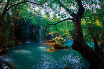 Beautiful waterfalls over emerald water in deep green forest in Kursunlu Natural Park, Antalya,...