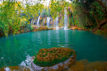Beautiful waterfalls over emerald water in deep green forest in Kursunlu Natural Park, Antalya, Turkey
