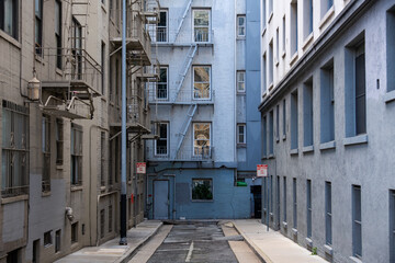 Backyard in downtown San Francisco (USA). Facades, balconies, windows, floor and walls of city...
