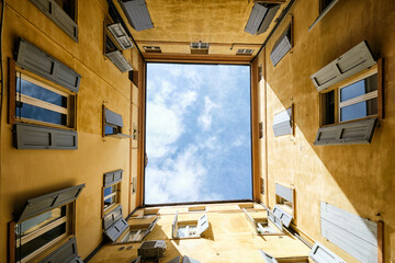 Upward view of the sky from a courtyard in Modena, Italy
