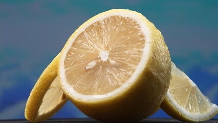 A slice of lemon, bright yellow and vibrantly citric, lies exposed. The yellow flesh, with...