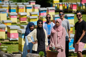 A diverse group of young friends and entrepreneurs explore small honey production businesses in the...
