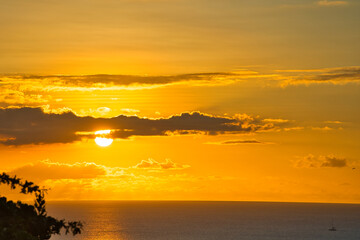Golden color sunset over the beach of beau vallon, Mahe Seychelles
