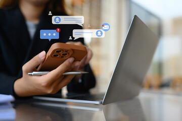 Closeup woman using mobile phone to communicating in social media platform