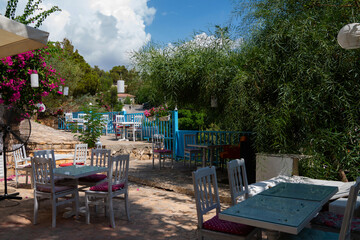 Old village. Charming old cafe. Typical beautiful village with flower and garden in Spain.