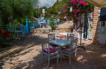 Old village. Charming old cafe. Typical beautiful village with flower and garden in Spain.