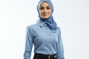 A young woman wearing a blue hijab and a blue shirt with a white collar