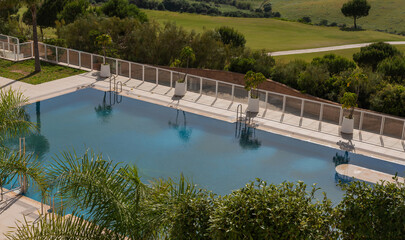 Luxury resort and blue swimming pool.