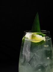 Refreshing lime cocktail on dark background
