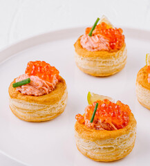 Elegant salmon tartare appetizers on white plate