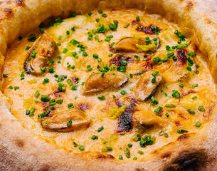 Traditional italian pizza with mussels close up