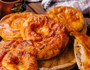 Traditional baked apple pies on wooden table