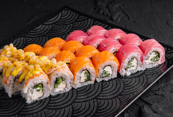 Assorted sushi set on black plate