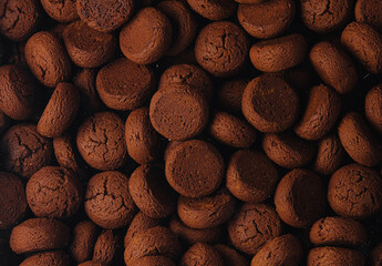 Box of chocolate cookies close up background