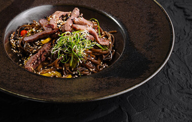 Gourmet beef stir fry on elegant plate