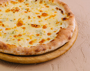 Fresh baked cheese pizza on wooden board