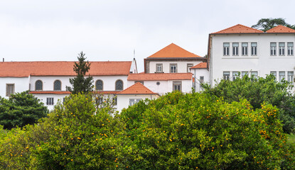 Historic building in old town Porto, Portugal. House facade of old historical building with windows. Exterior design of building with ornamental details.