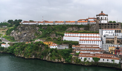 View of Porto Cathedral or Se Catedral built in 12th century and terracotta roofs of the Ribeira...