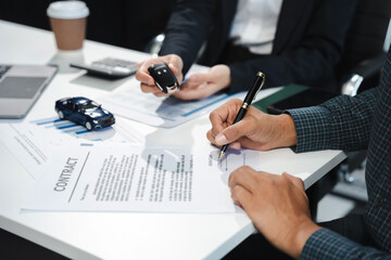 Automotive Business, Car Sale or Lease Concept: Car Dealership and sign contracts in car showrooms...