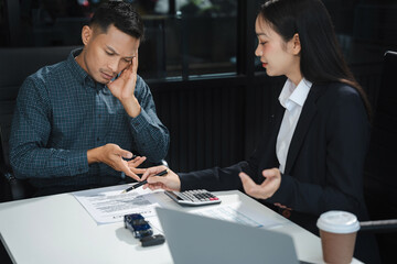 Automotive Business, Car Sale or Lease Concept: Car Dealership and sign contracts in car showrooms or car dealership offices.