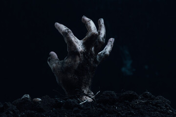 Zombie hand on black background. Halloween concept. Copy space.
