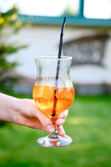 Apperol cocktail in hands