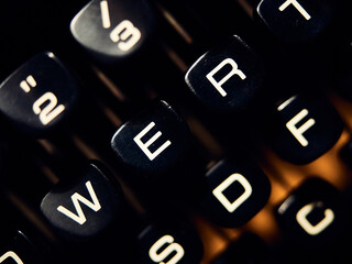 W, E and R letters in an old typing machine keyboard