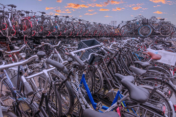 Large Bicycles Parking Lot and Sunset Sky in Amsterdam