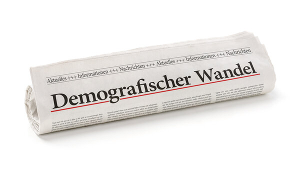 Zeitungsrolle mit der &Uuml;berschrift Demografischer Wandel