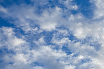 Bright sky texture background with white clouds, pleasing to the eye.