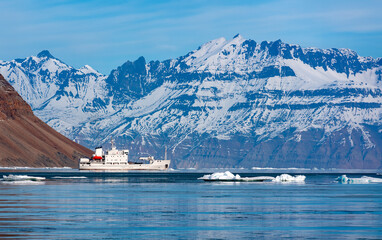 Tourist icebreaker exploring a fjord in Davy Sound on the northeast coast of Greenland.