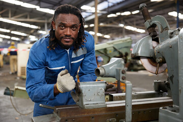 technician or worker checking and control lathe machine in the factory