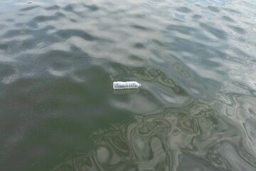 A plastic bottle floating in the sea. Plastic pollution concept.
