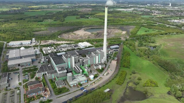 The Asdonkshof waste incineration plant in Kamp Lintfort. Thermal waste treatment and recycling. Combustion of waste, converted into new energy. Industrial installation. Aerial drone view.